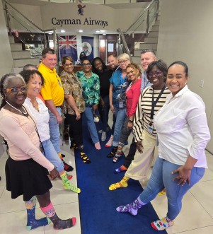Cayman Airways staff rock their socks for a cause